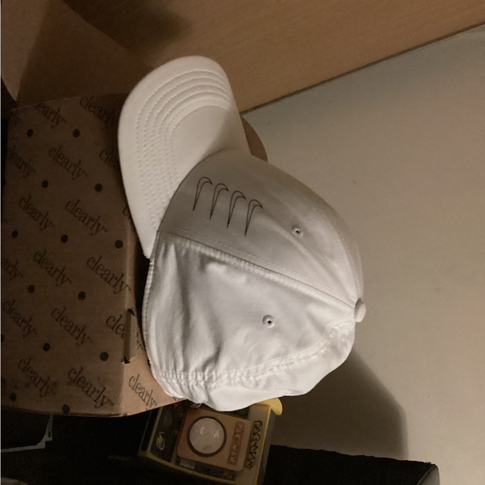 Nike White Cap with Swoosh Accent.